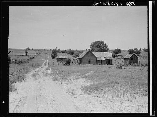Worn-out land and abandoned cabins near Newport, Oklahoma