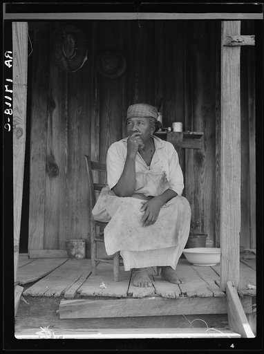 Hinds County, Mississippi. "Cotton rules the world," says this sharecropper woman