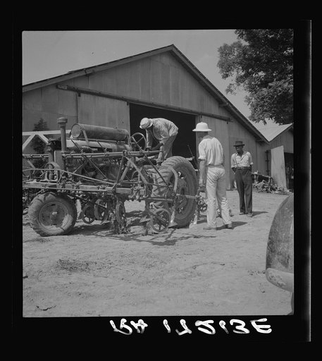 Aldridge Plantation, Mississippi. Tractor drivers are not allowed to do anything but drive tractors. Repairs are made by the mechanic at the plantation garage