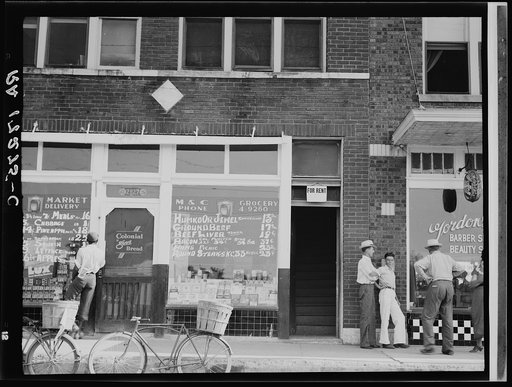 Under the "for rent" sign, through the door, one flight up, is the headquarters of the Southern Tenant Farmers Union. Memphis, Tennessee