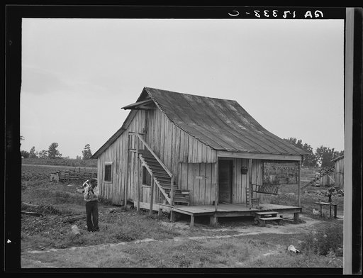 Cottonworker's cabin with outside stairway and loft. Near Blytheville, Arkansas