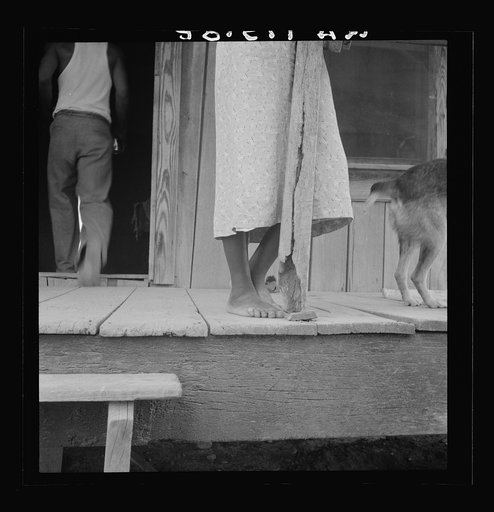 Front porch of sharecropper's cabin. Coahoma County, Mississippi