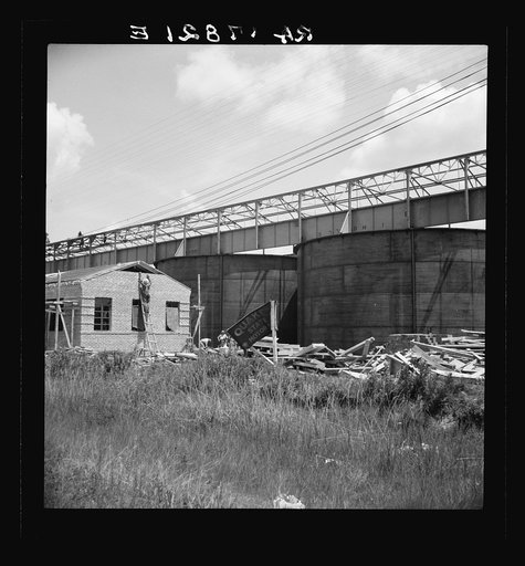 Large turpentine still and processing plant near Valdosta, Georgia. This represents industrialization of the turpentine process and forecasts the decline of small processors with their stills in the woods. Farmers will do their own chipping and dipping in the future and deliver the raw gum to the pl