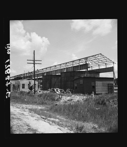 Untitled photo, possibly related to: Large turpentine still and processing plant near Valdosta, Georgia. This represents industrialization of the turpentine process and forecasts the decline of small processors with their stills in the woods. Farmers will do their own chipping and dipping in the fut