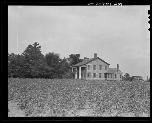 Pharr Plantation house near Social Circle, Georgia. This house was built in 1840 by slave labor. The bricks came from England to Savannah, thence by oxteam to the plantation. The plantation formerly had 150 slaves, is now abandoned by the one remaining member of the family, and the land rented out t