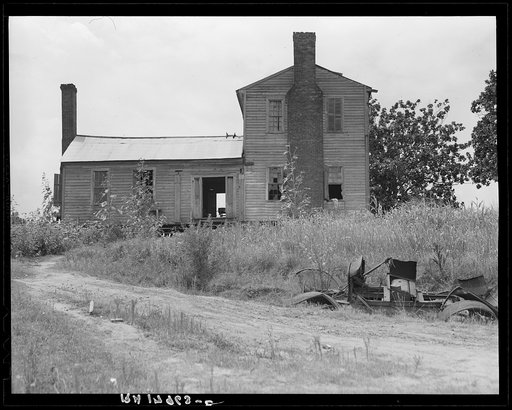 A plantation house decaying and now vacant but for two rooms occupied by an old couple, Negro tenants. Greene County, Georgia