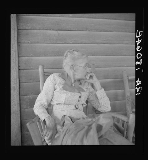Southern lady of the old school on the veranda of the "Big House" of the Wray Plantation, Georgia