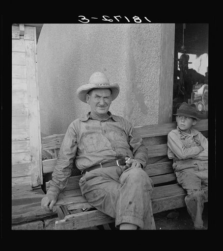 One of a group of western Oklahoma wheat farmers congregated at crossroads service station. "In 1934 I had four renters, and I didn't make anything. I bought tractors on the money the government give me, and I got shet of my renters. Right about half the people in these little towns used to be rente
