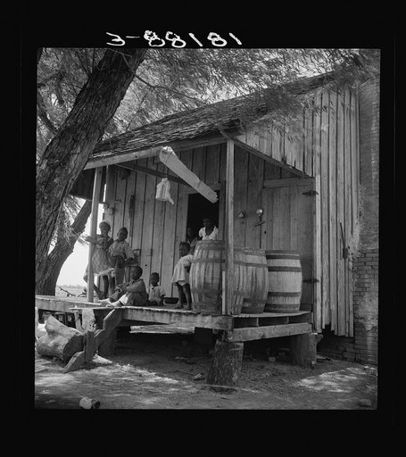 Water barrels on plantation cabin in Brazos riverbottoms, near Bryan, Texas