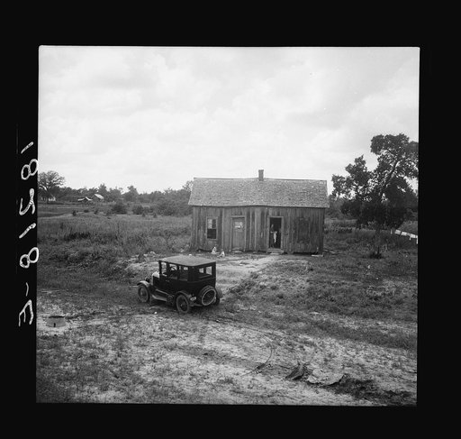 Home in a district from which many families immigrate West. Near Sallisaw, Oklahoma. Tenant farm family