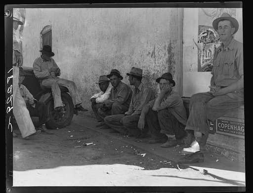 Migrant agricultural workers, idle in town during the potato harvest.  Shafter, California