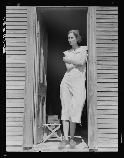 Migratory laborer's wife with three children (not in photo). Near Childress, Texas
