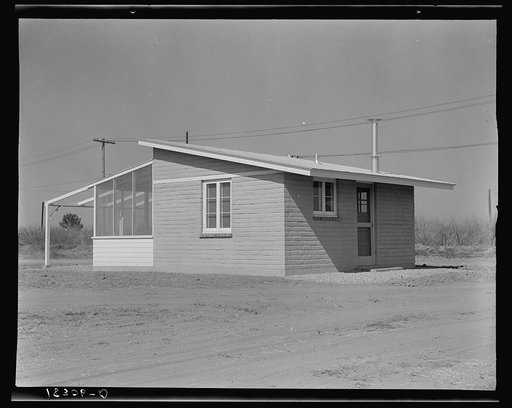 One of forty houses adjoining Arvin (Kern County) camp for migrants, California. These houses are built for and rented to migratory agricultural labor by Farm Security Administration. This house is designed to represent "one step up from the tent"