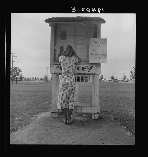 Untitled photo, possibly related to: Campers' bulletin board near entrance of Shafter camp for migrant workers. California