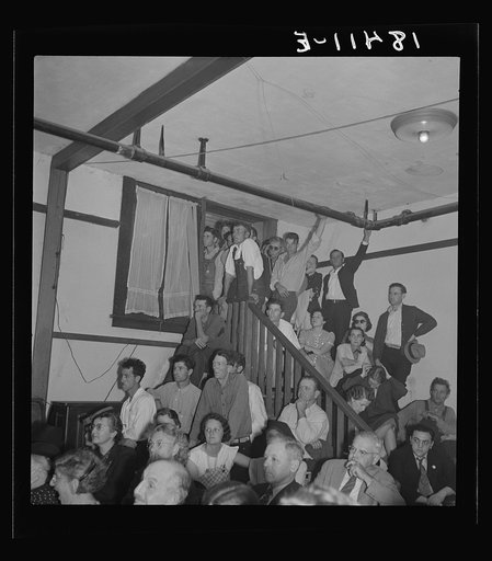 Listening to the speaker at the Conference to Aid Agricultural Organization during the cotton strike (Steinbeck Committee). Bakersfield, Kern County, California