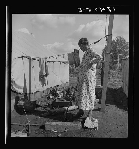 Women in auto camp for migrant citrus workers. Tulare County, California
