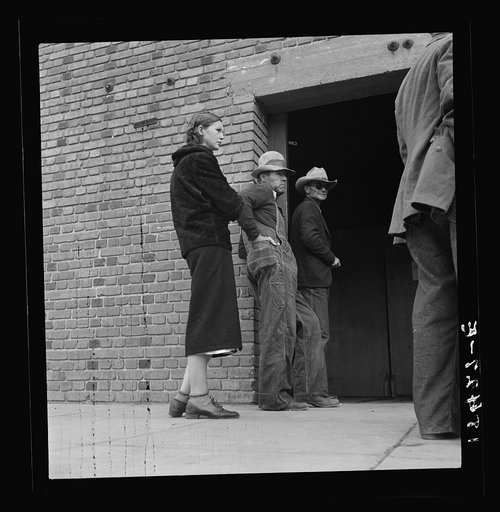 Destitute farm families come to FSA (Farm Security Administration) distributing depot to apply for food grant. Bakersfield, Kern County, California