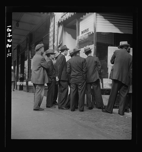 Untitled photo, possibly related to: In front of the local paper of San Francisco's Chinatown Chinese read news of the surrender of Canton to the Japanese. Most of San Francisco's Chinese are Cantonese