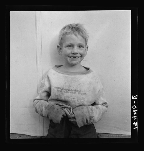Migrant cotton picker's child who lives in a tent in the government camp instead of along the highway or in a ditch bank. Shafter Camp for migrants, California