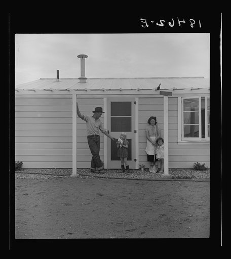 Untitled photo, possibly related to: Type of house in Shafter camp for migratory workers, California. These homes represent a first step in stabilization of this group. This is the first family to be selected by Farm Security Administration for housing