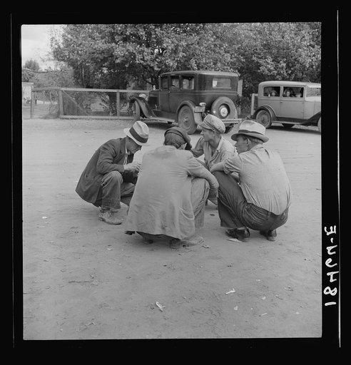Striking cotton pickers talk it over. The strike is failing. Kern County, California. "I don't care: Let them throw me in jail. There's somebody will take my place"