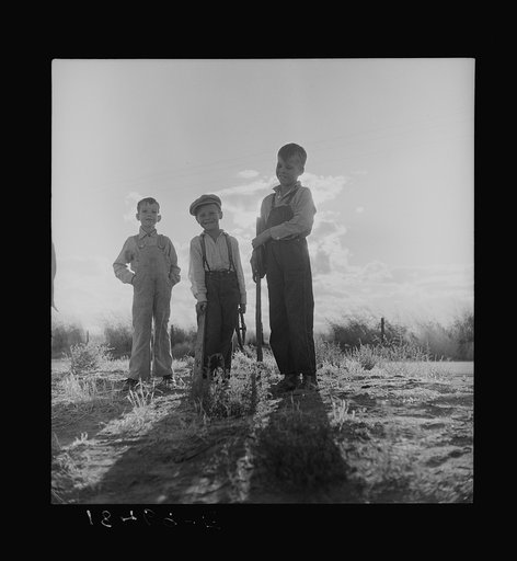 Children of refugee families now on Works Progress Administration (WPA). They live in tents on the flats outside of Bakersfield, California