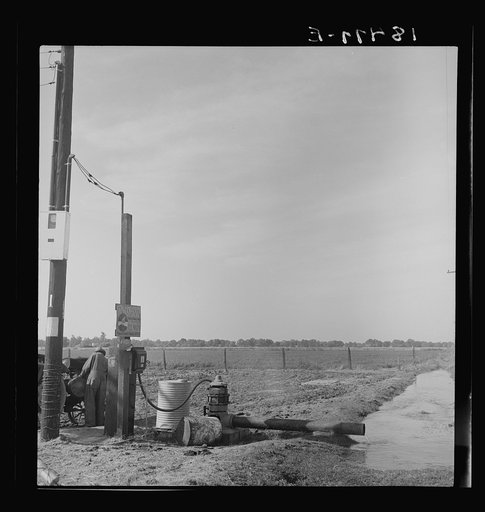Irrigation pump on edge of field. Electric power typical of San Joaquin Valley farming. California
