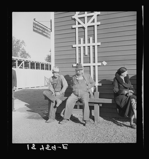 Lineup outside of Farm Security Administration grant office (relief to farm laborers) early in the morning, before the office has opened. Tulare, California