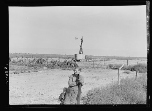 Untitled photo, possibly related to: Rural rehabilitation client talking with county supervisor, Farm Security Administration (FSA), Tulare County, California. She says: "Someday I'm going to build my house. Right over there by that garden"