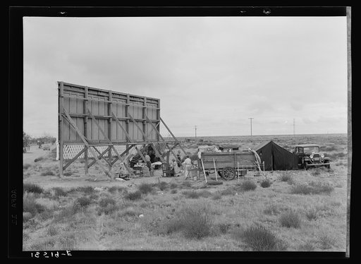 Three families camped on the plains along U.S. 99 in California