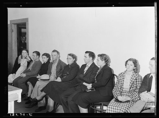 Night meeting in the Farm Security Administration office, Rural Rehabilitation Division, Visalia, Tulare County, California. 144 families have applied for farm purchase loans under the Farm Tenancy Act, passed by Congress in 1937. Ten applicants from this region of four counties will be finally sele
