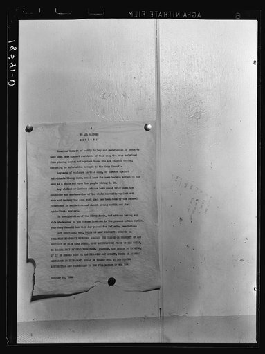 Camp bulletin board in Shafter camp for migratory workers, Farm Security Administration (FSA) camp, California. This notice is a statement of self-determined policy drawn up by the camp committee of elected officers, known as the camp council