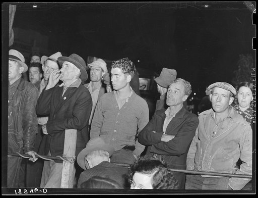 Untitled photo, possibly related to: Street meeting at night in Mexican town outside of Shafter, California. Organizer for United Cannery Agricultural Packing and Allied Workers of America (Congress of Industrial Organizations-CIO) talks to mixed crowd. The strike failed