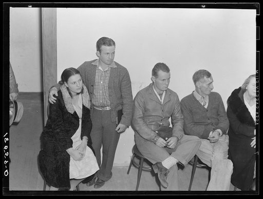 Night meeting in the Farm Security Administration (FSA) office, Rural Rehabilitation Division, Visalia, Tulare County, California. 144 families have applied for Farm Purchase Loans under the Farm Tenancy Act, passed by Congress in 1937. Ten applicants from this region of four counties will be finall