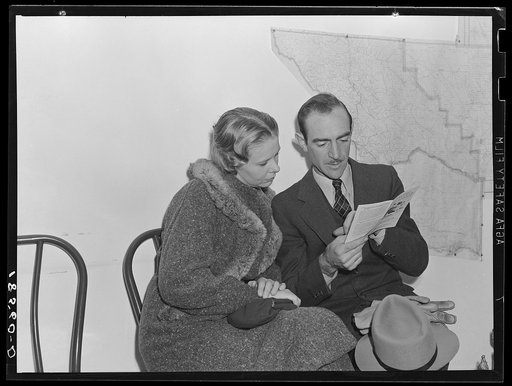 Night meeting in the Farm Security Administration (FSA) office, Rural Rehabilitation Division, Visalia, Tulare County, California. 144 families have applied for Farm Purchase Loans under the Farm Tenancy Act, passed by Congress in 1937. Ten applicants from this region of four counties will be finall