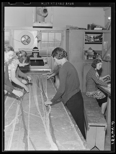 Untitled photo, possibly related to: In the sewing room, migrant women are instructed in rug-making. Shafter camp for migrants (Farm Security Administration-FSA), California. Recreational, educational, cooperative activities in the camp are aided by Work Projects Administration instructors assigned 