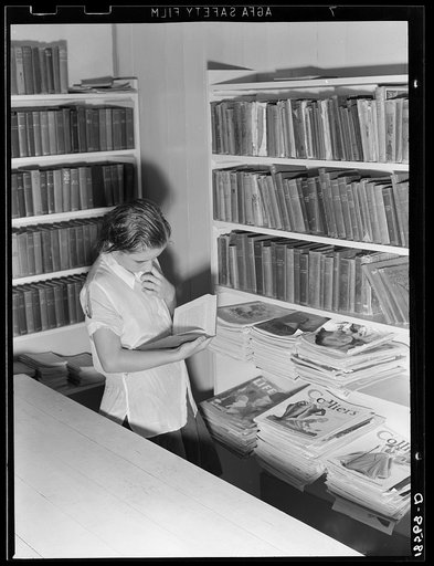 Arvin camp for migrant workers (Farm Security Administration-FSA) California. A small library in camp with Works Progress Administration (WPA) librarian in charge is now available to agricultural workers. Part of the program for recreational and education instituted in all government camps for migra