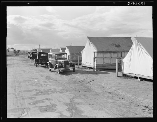 Shafter camp for migrant workers (Farm Security Administration-FSA), California. Tent platforms are supplied. Workers supply their own tents. The newer camps are experimenting with prefabricated steel one-room houses