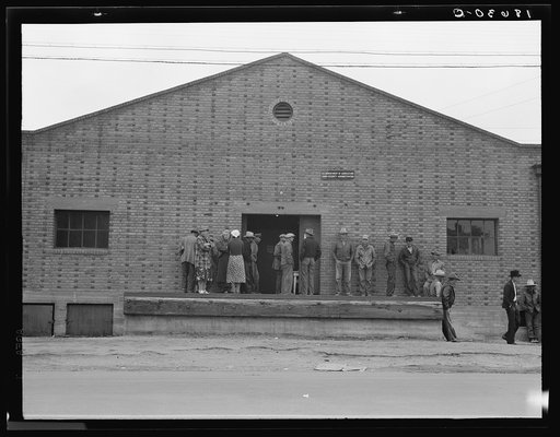 Untitled photo, possibly related to: Warehouse, used as distributing office for Farm Security Administration (FSA) relief grants of commodities to destitute farm labor families during cotton strike of October 1938. Bakersfield, California