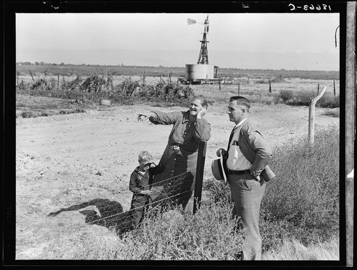 Rural rehabilitation client talking with county supervisor, Farm Security Administration (FSA), Tulare County, California. She says: "Someday I'm going to build my house. Right over there by that garden"