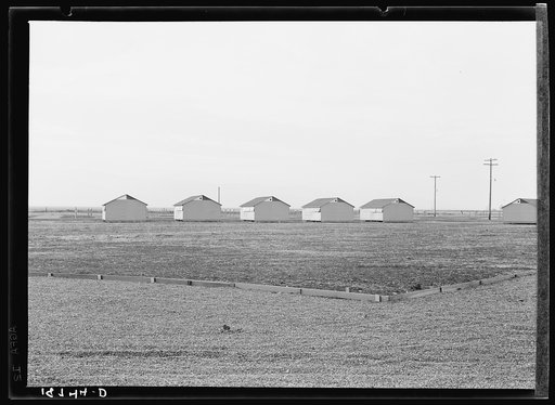 United States government camp for migratory workers (Farm Security Administration-FSA), Westley, California. Pre-fabricated steel shelters replace the use of tents and tent platforms in this newly constructed camp