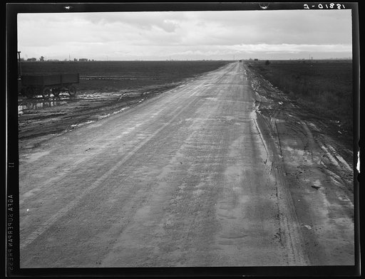 Untitled photo, possibly related to: Kern County, California. County road between potato fields