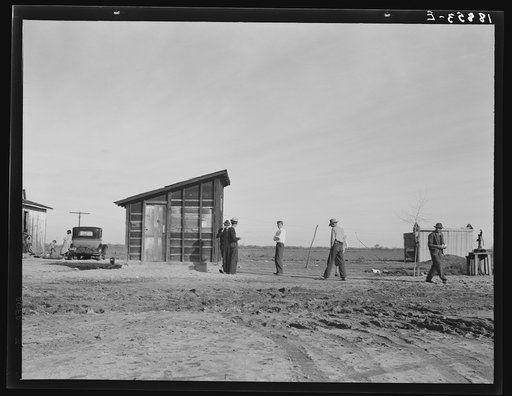 Untitled photo, possibly relatd to: Outskirts of Firebaugh. West side of San Joaquin Valley, California. Six families with twenty-two children live in this house. Cotton workers: "He's good (the boss). He lets us live here without paying rent."