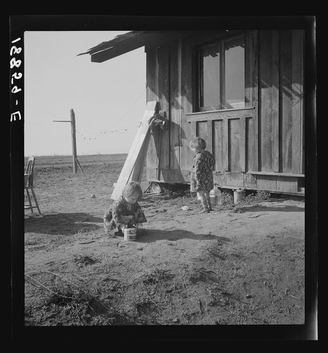 Untitled photo, possibly related to: On the plains west of Fresno, California. Family of seven from Oregon dairy ranch which they lost. "We tried to get too big, I guess. Milk cans are all that's left of the dairy. Now pick bolls to make fifty cents to one dollar a day. We can't work every day or ma