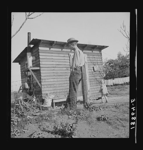 Untitled photo, possibly related to: Madera County, family from near Dallas, Texas. Rent is five dollars a month. "There's no future here. I've been following the work (migratory labor) but there's no chance for a fellow to get a holt hisself in this country. The last job I had is tractor driving fo