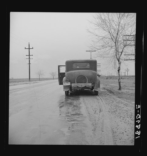Untitled photo, possibly related to: U.S. 99. Near Tulare, California. Entered California fall of 1938. En-route to pea harvest in Imperial Valley. Car broke-down. "Want to get back to Missouri if they can ever get the money."