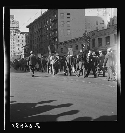 Untitled photo, possibly related to: Mass meeting of Works Progress Administration (WPA) workers parading up Market Street, San Francisco, California. The meeting was held in protest to cuts made by Congress in relief appropriations