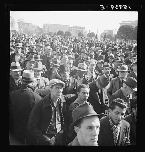 Listening to speeches at mass meeting of Works Progress Administration (WPA) workers protesting congressional cut of relief appropriations. San Francisco, California