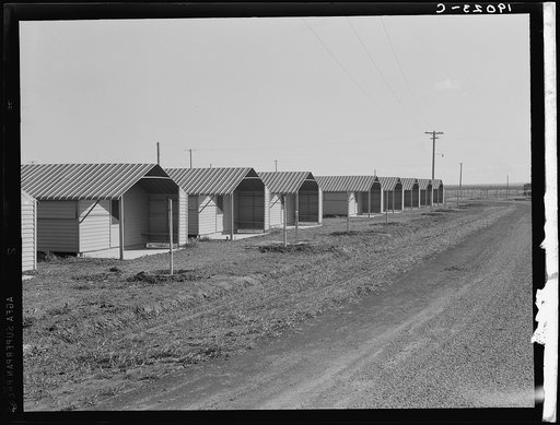 United States Government camp for migratory workers, (FSA - Farm Security Administration), Westley, California. Pre-fabricated steel shelters replace the use of tents and tent platforms in this newly constructed camp