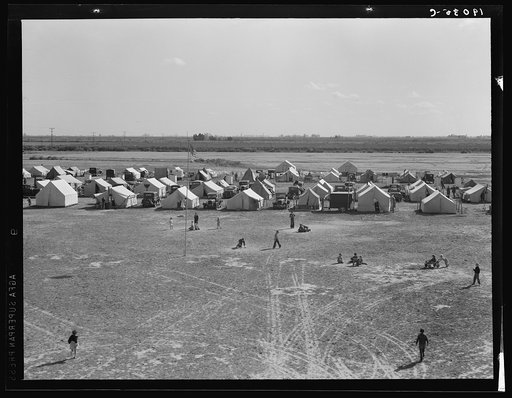 Farm Security Administration (FSA) migrant labor camp. Calipatria, Imperial Valley, California. 155 migrant families in camp. One third had no work; two-thirds were finding part-time work harvesting spring peas, earning on average (head of family) four dollars and twenty cents a week